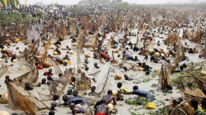 People sitting on beach during Argungu Festival in Northwest Nigeria