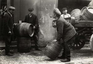 Heineken employees unloading barrels of beer 