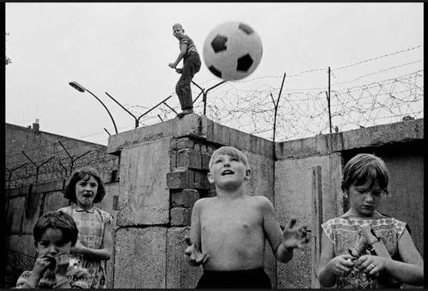 Berlin divided life children playing Berlin Wall 25 years