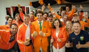 Picture of Marco van Houwelingen and Heineken fans dressed in orange