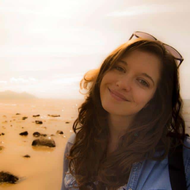young woman smiling on beach