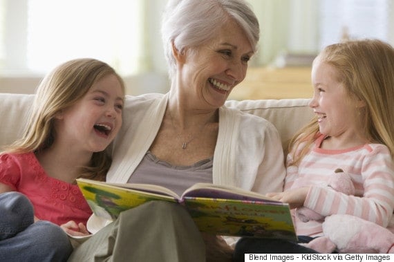 grandmother reading to grandchildren